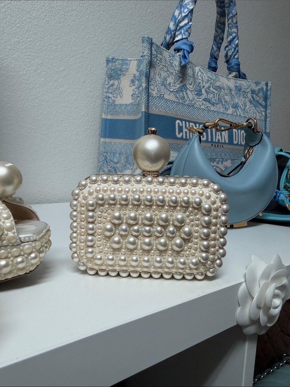 Jimmy Choo Micro Cloud
White Suede Clutch Bag with All-Over Pearl Embellishment